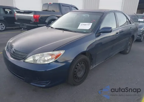 2003 Toyota Camry Le z USA, uszkodzony, nr VIN 4T1BE32K73U229696